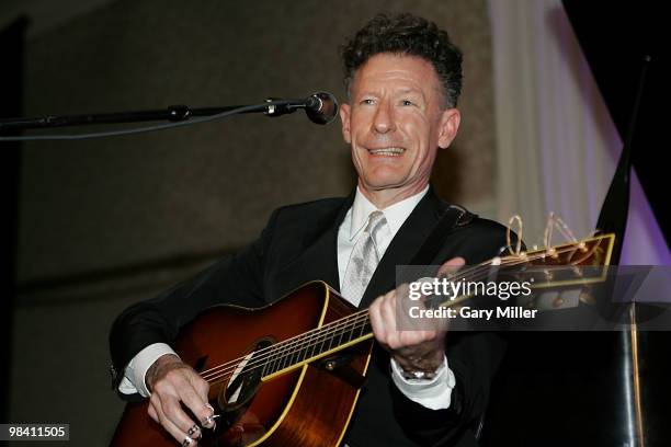 Musician/vocalist Lyle Lovett performs at the Nobelity Project's dinner honoring Willie Nelson with the "Feed The Peace" award at the Four Seasons...