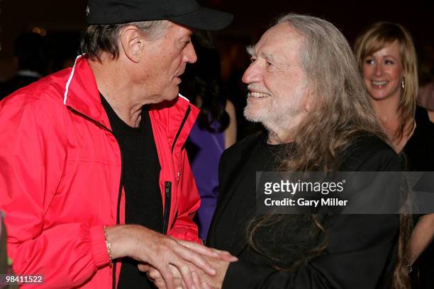 Actor Peter Fonda and Willie Nelson chat at the Nobelity Project's dinner honoring Willie Nelson with the "Feed The Peace" award at the Four Seasons...