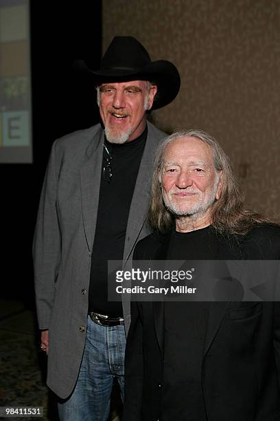 Musicians Ray Benson and Willie Nelson pose on the red carpet for the Nobelity Project's dinner honoring country music legend Willie Nelson with the...