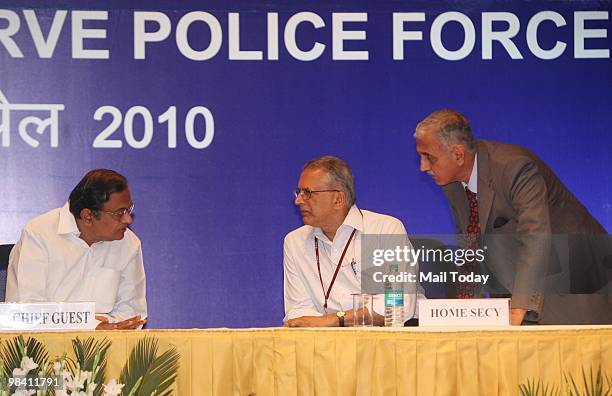 Union Home Minister P Chidambaram talks with Home Secretary GK Pillai and IB Director Arun Mathur during the Valour Day function of the Central...