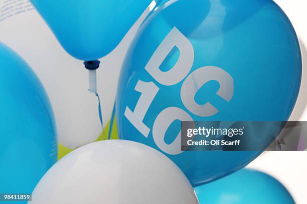 Conservative party balloons are held by a party supporters in Loughborough's Market Place on April 12, 2010 in Loughborough, England. Mr Cameron...