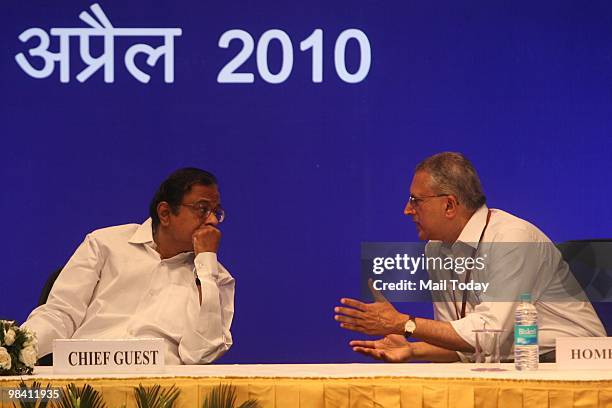 Union Home Minister P Chidambaram talks with Home Secretary GK Pillai during the Valour Day function of the Central Reserve Police Force in New Delhi...