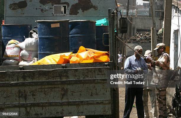 Mayapuri's radioactive scrap is loaded on to a BARC truck in New Delhi on April 9, 2010. 6 people have been admitted to various hospitals with...