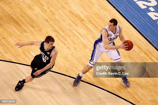 Miles Plumlee of the Duke Blue Devils looks to pass the ball against Gordon Hayward of the Butler Bulldogs during the 2010 NCAA Division I Men's...