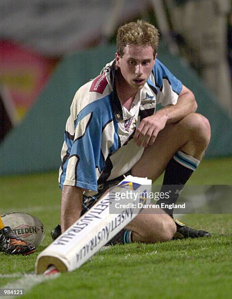 Colin Best of the Sharks reacts after being tackled and taking out the corner post to miss out on a try against Brisbane during the round 11 NRL...
