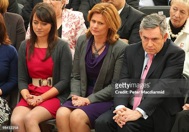 Labour Party supporter Ellie Gellard sits next to Sarah Brown and Prime Minister Gordon Brown as he launches his election manifesto at The Queen...