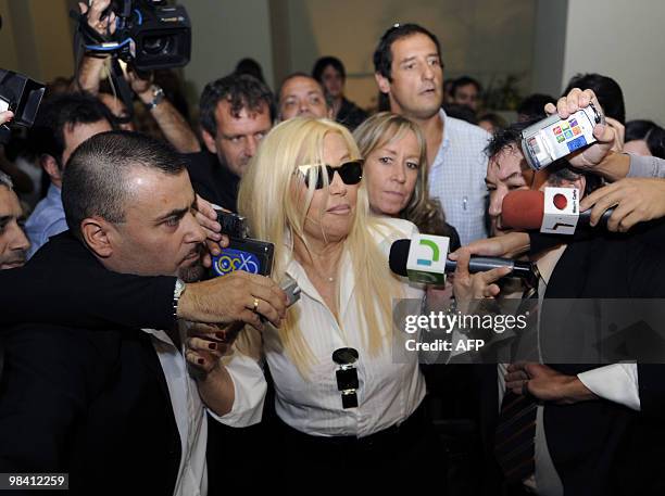 Argentine TV diva Susana Gimenez arrives to a court in Montevideo sorrounded by the press on April 12 after she sued Uruguayan weekly magazine Caras...