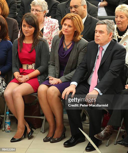 Labour Party supporter Ellie Gellard sits next to Sarah Brown and Prime Minister Gordon Brown as he launches his election manifesto at The Queen...