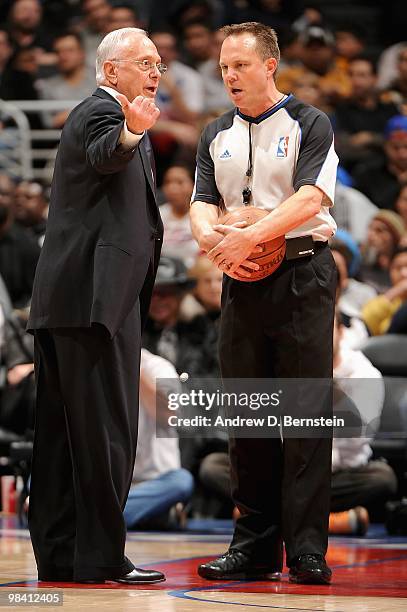 Head coach Larry Brown of the Charlotte Bobcats discusses a call with referee Bill Spooner during the game against the Los Angeles Clippers on...