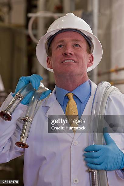 engineer in a chemical plant - industrial hose stockfoto's en -beelden