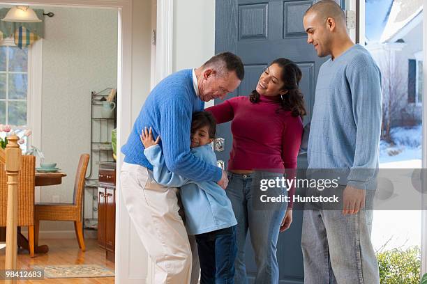 man welcoming his children and granddaughter - puerto rican ethnicity stock pictures, royalty-free photos & images