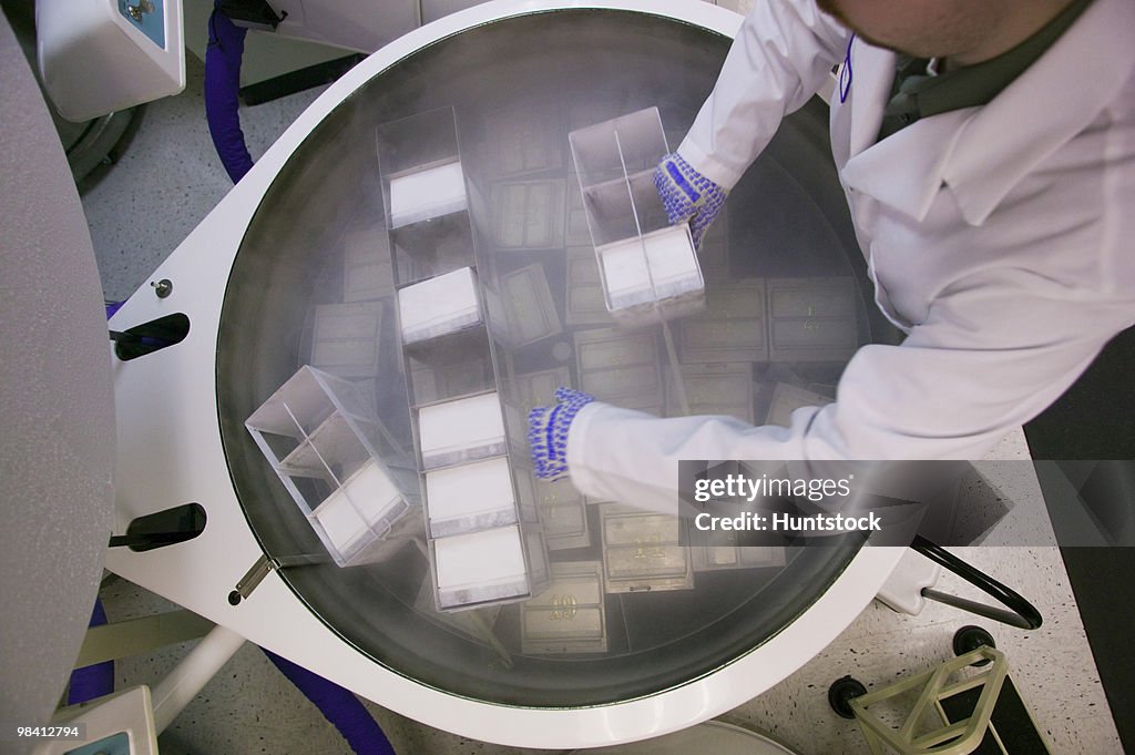 Scientist working on a liquid nitrogen container