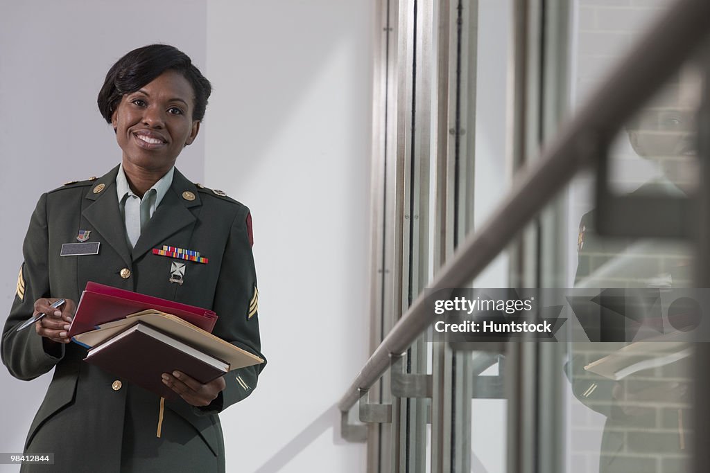 Female Hispanic nurse in the US army holding diaries