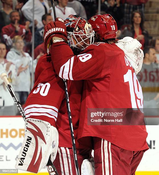 Goaltender Ilya Bryzgalov and teammate Shane Doan of the Phoenix Coyotes celebrate a victory against the Nashville Predators on April 7, 2010 at...