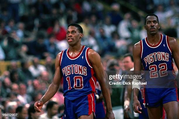 Dennis Rodman and John Salley of the Detroit Pistons stand against the Boston Celtics during a game played in 1989 at the Boston Garden in Boston,...