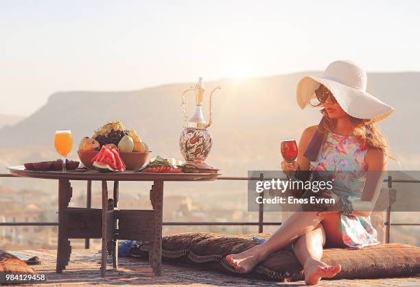 young woman toasting with red wine - cheers - urgup stock pictures, royalty-free photos & images
