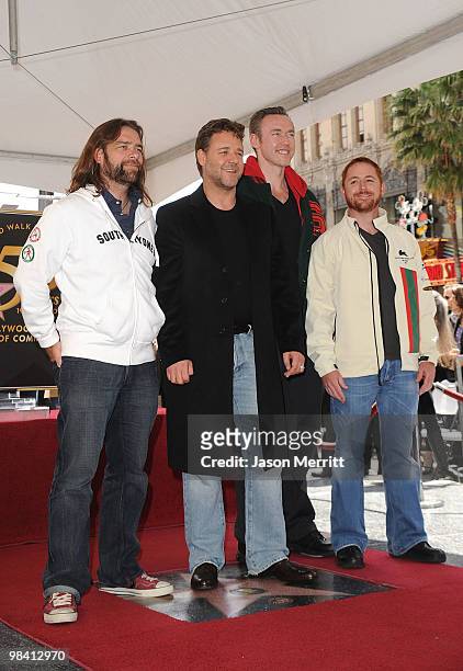 Actors Russell Crowe, Kevin Durand, and Scott Grimes pose while actor Russell Crowe is honored on the Hollywood Walk Of Fame on April 12, 2010 in...