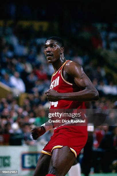 Hakeem Olajuwon of the Houston Rockets runs against the Boston Celtics during a game played in 1989 at the Boston Garden in Boston, Massachusetts....