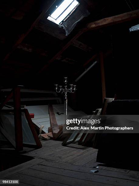 a dark attic full of lumber sweden. - attic storage stockfoto's en -beelden