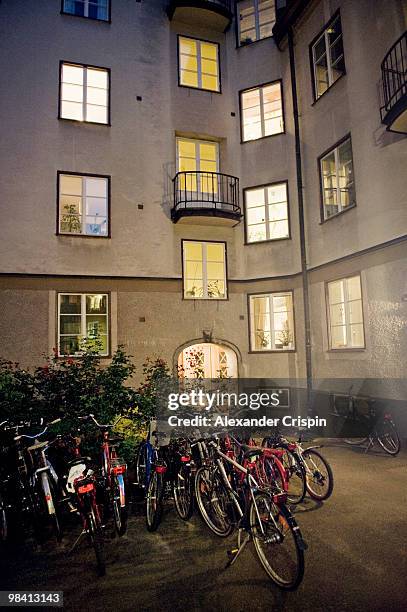 enlightened windows in a block of flats stockholm sweden. - block flats stock-fotos und bilder