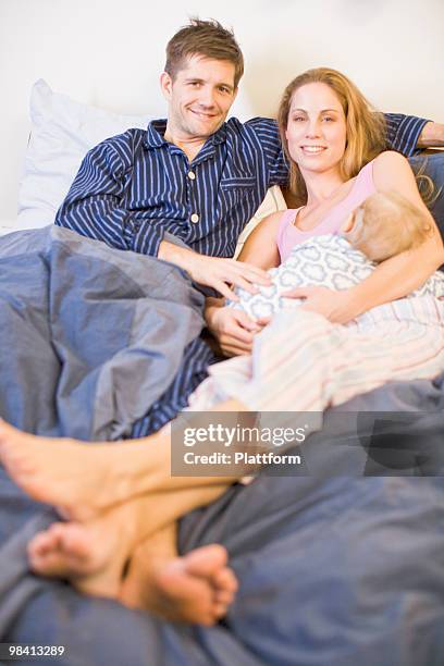 a family in a bed sweden. - plattform stock pictures, royalty-free photos & images