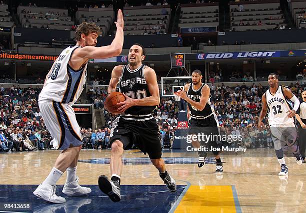 Manu Ginobili of the San Antonio Spurs drives to the basket against Marc Gasol of the Memphis Grizzlies during the game at the FedExForum on March 6,...