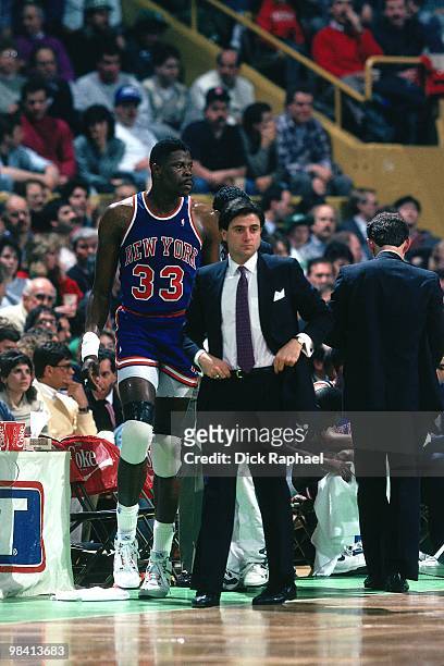 Head coach Rick Pitino and Patrick Ewing of the New York Knicks stand on the sideline against the Boston Celtics during a game played in 1989 at the...