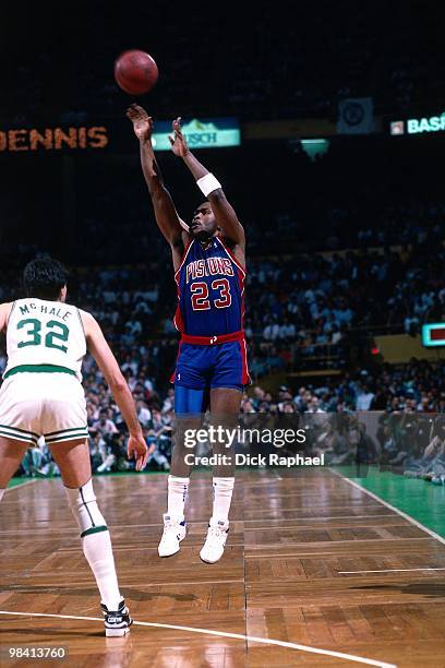 Mark Aguirre of the Detroit Pistons shoots a jump shot against Kevin McHale of the Boston Celtics during a game played in 1989 at the Boston Garden...