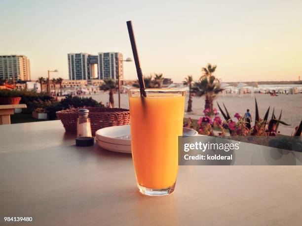 fresh squeezed orange juice - acid trip stock pictures, royalty-free photos & images