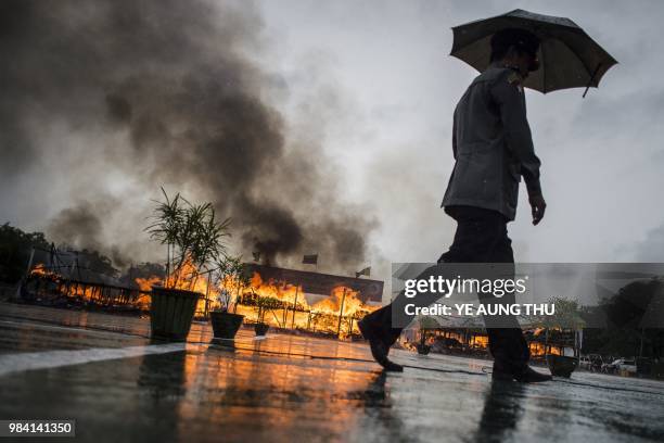 Myanmar law enforcement authorities burn seized illegal drugs worth 187 million USD, marking the International Day against Drug Abuse and Illicit...