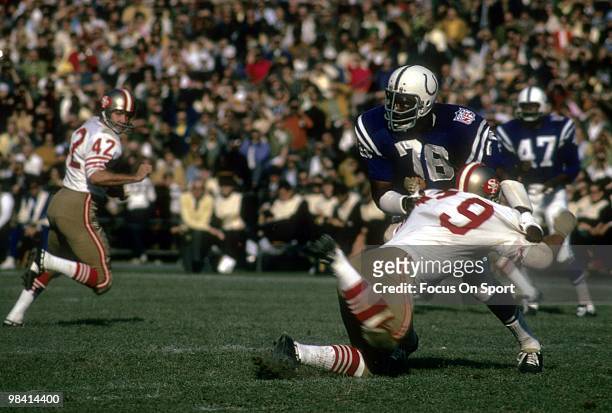 Defensive Tackle Bubba Smith of the Baltimore Colts throws to the ground tackle Cas Banaszek of the San Francisco 49ers circa circa 1969 during an...