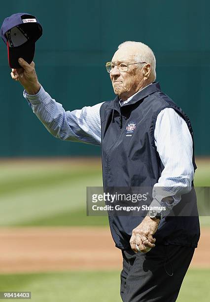 Hall of Fame Cleveland Indian pitcher Bob Feller tips his cap to fans prior to the Cleveland Indians playing the Texas Rangers during Opening Day on...