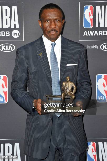 Dwane Casey, winner of the 2017-2018 Coach of the Year award, poses in the backstage photo room during the 2018 NBA Awards Show at Barker Hangar on...