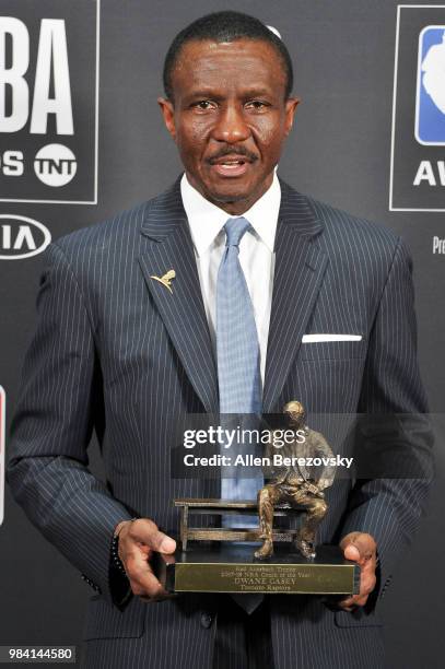 Dwane Casey, winner of the 2017-2018 Coach of the Year award, poses in the backstage photo room during the 2018 NBA Awards Show at Barker Hangar on...