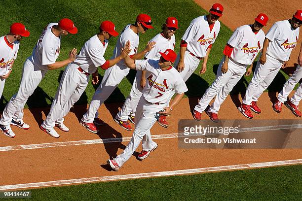 Matt Holliday of the St. Louis Cardinals greets his teammates during pre-game introductions prior to playing against the Houston Astros in the home...