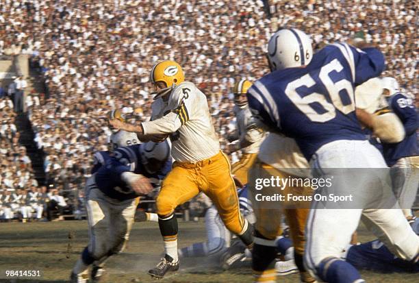 S: Running back Paul Hornung of the Green Bay Packers carries the ball against the Baltimore Colts circa mid 1960's during a NFL football game at...