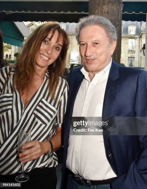 Writer Anna Veronique El Baze and Michel Drucker attend "L'Ete Litteraire Des Deux Magots " : Book Signing Cocktail at Les Deux Magots Cafe on June...