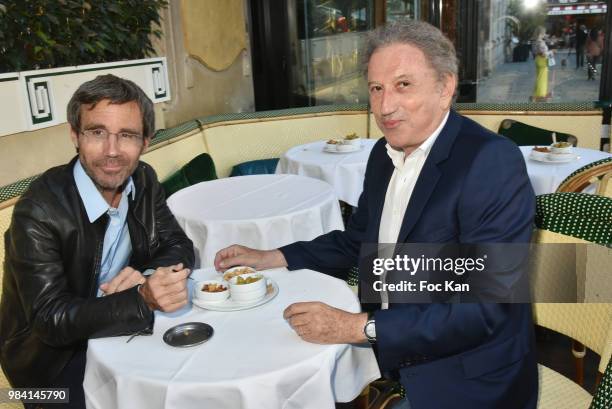 Presenters David Pujadas and Michel Drucker attend "L'Ete Litteraire Des Deux Magots " : Book Signing Cocktail at Les Deux Magots Cafe on June 25,...