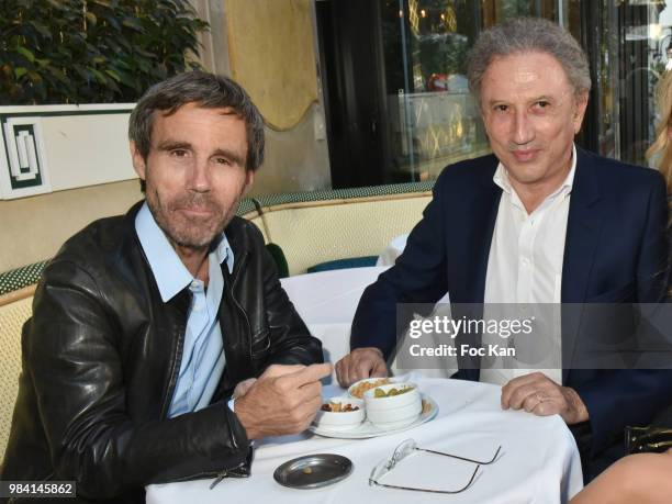 Presenters David Pujadas and Michel Drucker attend "L'Ete Litteraire Des Deux Magots " : Book Signing Cocktail at Les Deux Magots Cafe on June 25,...