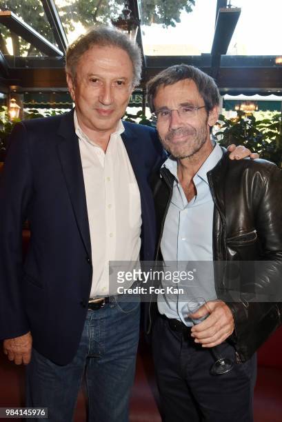 Presenters Michel Drucker and David Pujadas attend "L'Ete Litteraire Des Deux Magots " : Book Signing Cocktail at Les Deux Magots Cafe on June 25,...