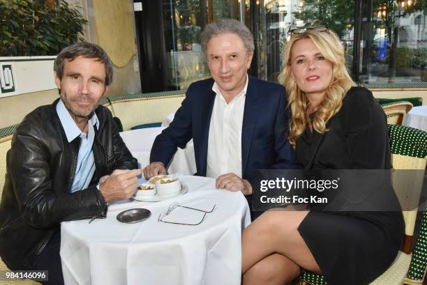 Presenters David Pujadas, Michel Drucker and PR Carole Fernandez attend "L'Ete Litteraire Des Deux Magots " : Book Signing Cocktail at Les Deux...