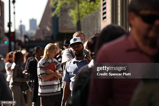 Hundreds of people looking for employment wait in line at an AARP job fair with an emphasis on individuals 50 years old and over on April 12, 2010 in...