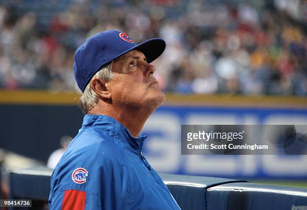 Manager Lou Piniella of the Chicago Cubs looks to the skies during the game against the Atlanta Braves at Turner Field on April 8, 2010 in Atlanta,...