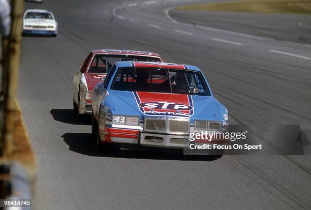 Nascar Driver Richard Petty in action in the STP leading Bobby Allison n the car February 17, 1985 during the Nascar Winston Cup Daytona 500 at...