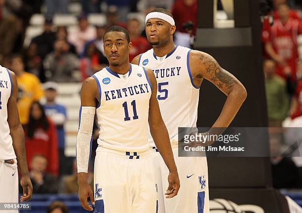 John Wall and DeMarcus Cousins of the Kentucky Wildcats look on against the Cornell Big Red during the east regional semifinal of the 2010 NCAA men's...