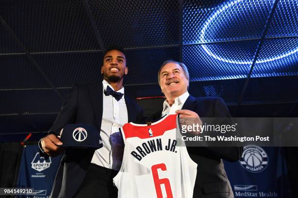 Washington Wizards President Ernie Grunfeld, right, poses with Troy Brown Jr., the team's first-round pick in the 2018 NBA Draft at a press...