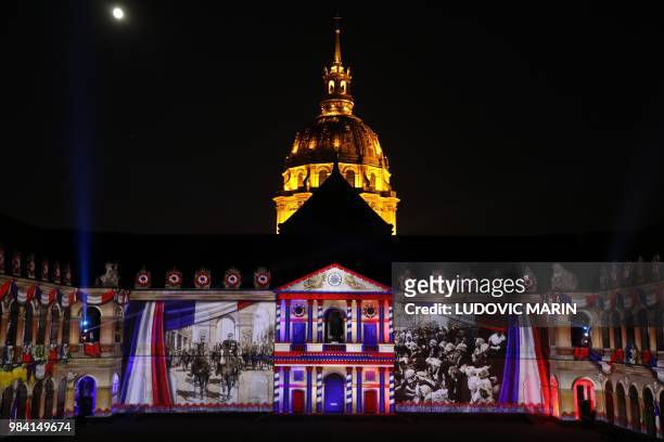 Light projection illuminates the facade of the Hotel des Invalides in Paris during the show "1918-The Rise Of A New World" on June 25, 2018. /...