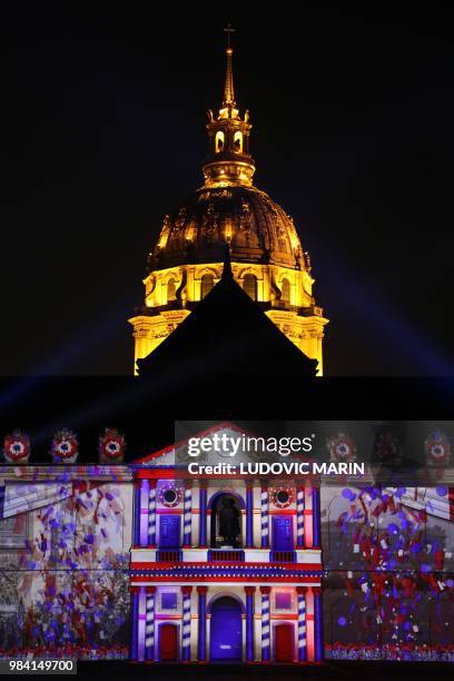 Light projection illuminates the facade of the Hotel des Invalides in Paris during the show "1918-The Rise Of A New World" on June 25, 2018. /...