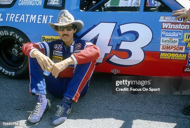 Nascar driver Richard Petty in this portrait sitting next to the STP car February 15, 1987 before the Nascar Winston Cup Daytona 500 race at Daytona...