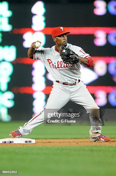 Jimmy Rollins of the Philadelphia Phillies throws the ball to first base against the Washington Nationals at Nationals Park on April 7, 2010 in...